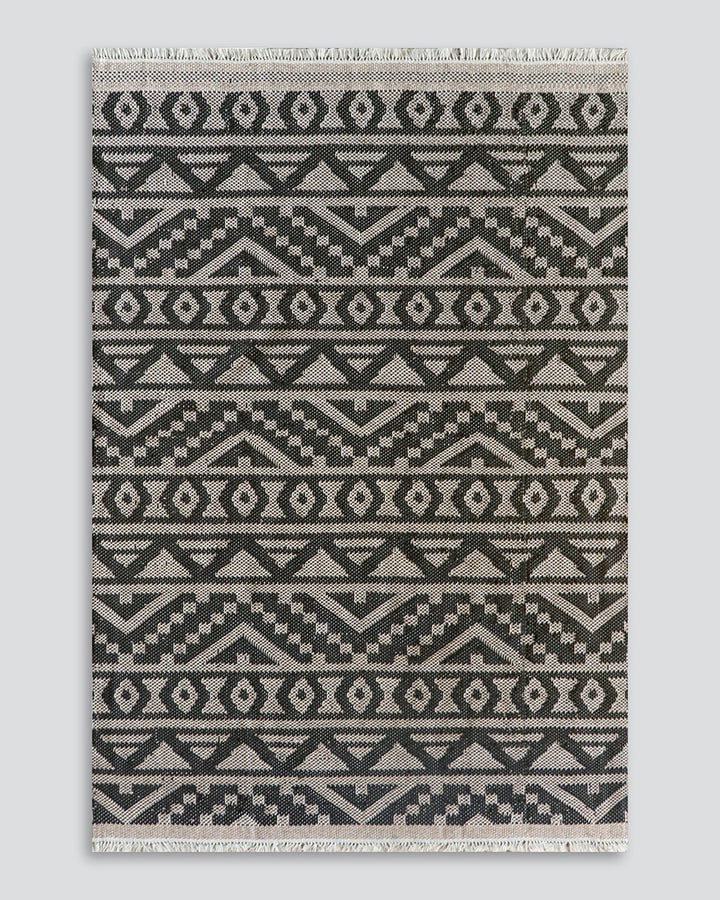 Sifiso Floor Rug Handwoven from durable polypropylene, the Sifiso outdoor rug is finished with a relaxed, hand-knotted fringe edging. Soft underfoot, the ethnic-inspired design looks stunning on any surface and can be used in and outdoors interchangeably.