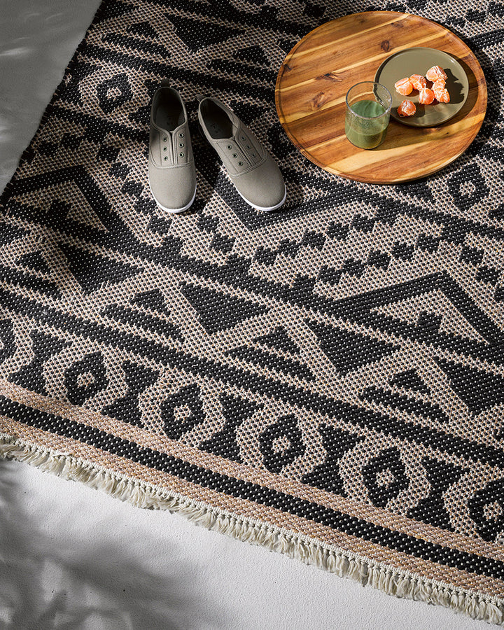 Sifiso Floor Rug Handwoven from durable polypropylene, the Sifiso outdoor rug is finished with a relaxed, hand-knotted fringe edging. Soft underfoot, the ethnic-inspired design looks stunning on any surface and can be used in and outdoors interchangeably.