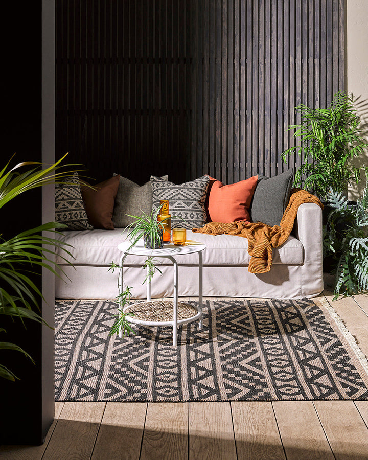 Sifiso Floor Rug Handwoven from durable polypropylene, the Sifiso outdoor rug is finished with a relaxed, hand-knotted fringe edging. Soft underfoot, the ethnic-inspired design looks stunning on any surface and can be used in and outdoors interchangeably.