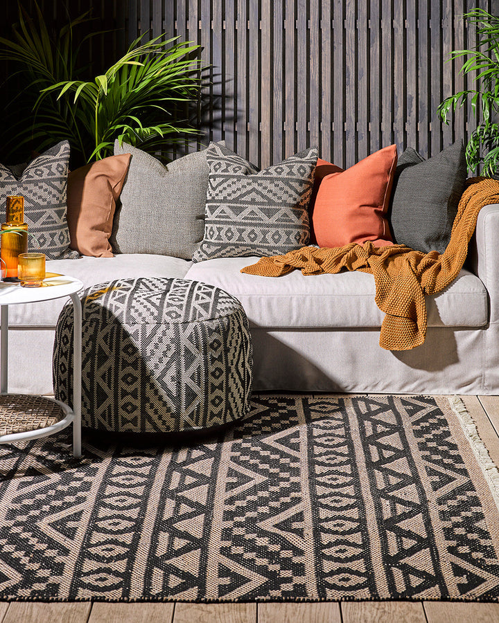 Sifiso Floor Rug Handwoven from durable polypropylene, the Sifiso outdoor rug is finished with a relaxed, hand-knotted fringe edging. Soft underfoot, the ethnic-inspired design looks stunning on any surface and can be used in and outdoors interchangeably.