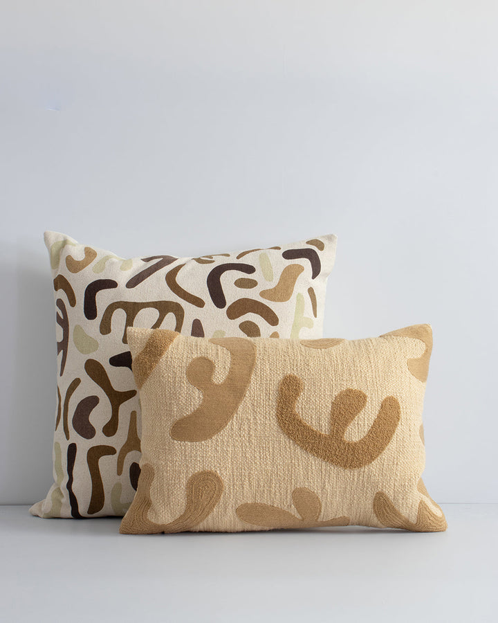 Sabina Cushion Embroidered, boucle and textural elements come together in this Matisse-inspired cushion. Hand-cut, oversized forms are assembled onto a tactile, cotton base, with a tone-on-tone aesthetic. Mix the lumbar shape with Flaxmill Pecan and Silho