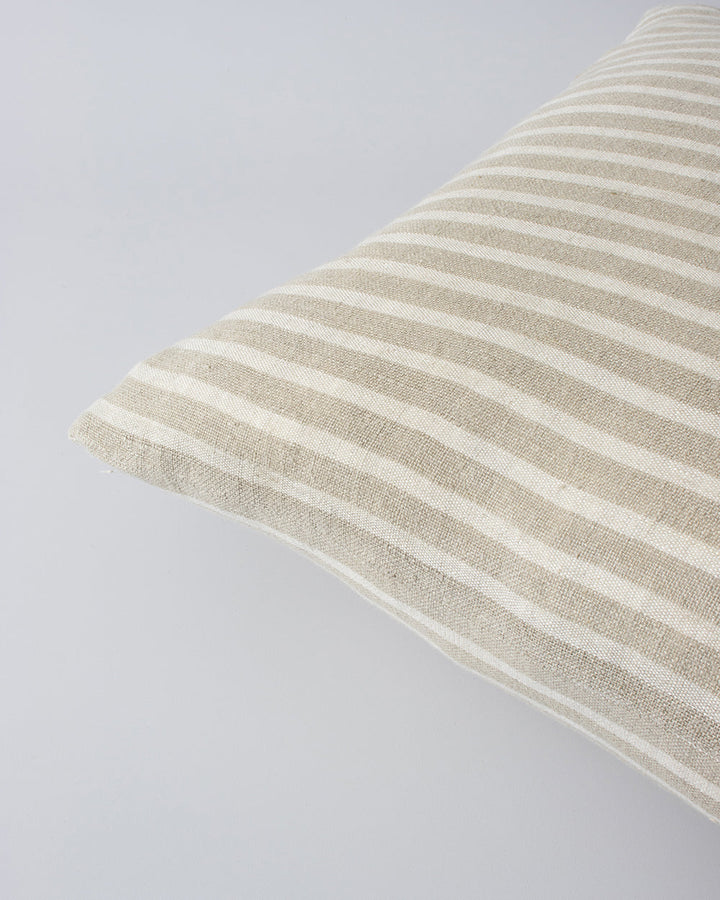 Spencer Cushion The essence of understated elegance is celebrated with the classic Bengal stripe design of the Spencer. Handwoven by skilled artisans, the medium-weight fabric embracesÂ the natural beauty of linen fibres, instilling an earthy, organic fee