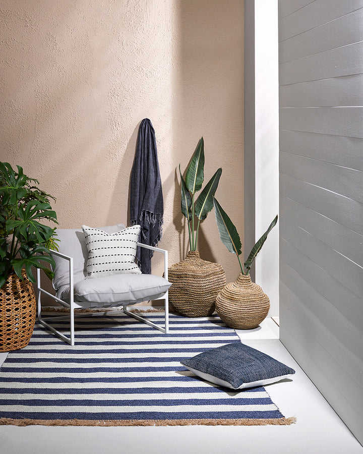 Summit Floor Rug A contemporary and fully reversible outdoor rug. The handcrafted double-weave stripe design looks stunning on any surface and can be used indoors and outdoors interchangeably. Featuring a heavy stripe on one side, and a finer design on th