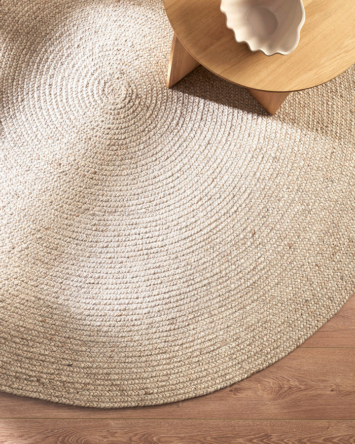 Tairua Floor Rug Anchor key furniture pieces or make the most of smaller spaces with this contemporary braided design. Understated and inviting, the subtly mottled yarn provides a neutral base around which to style a timeless interior. Australian Stock Bu