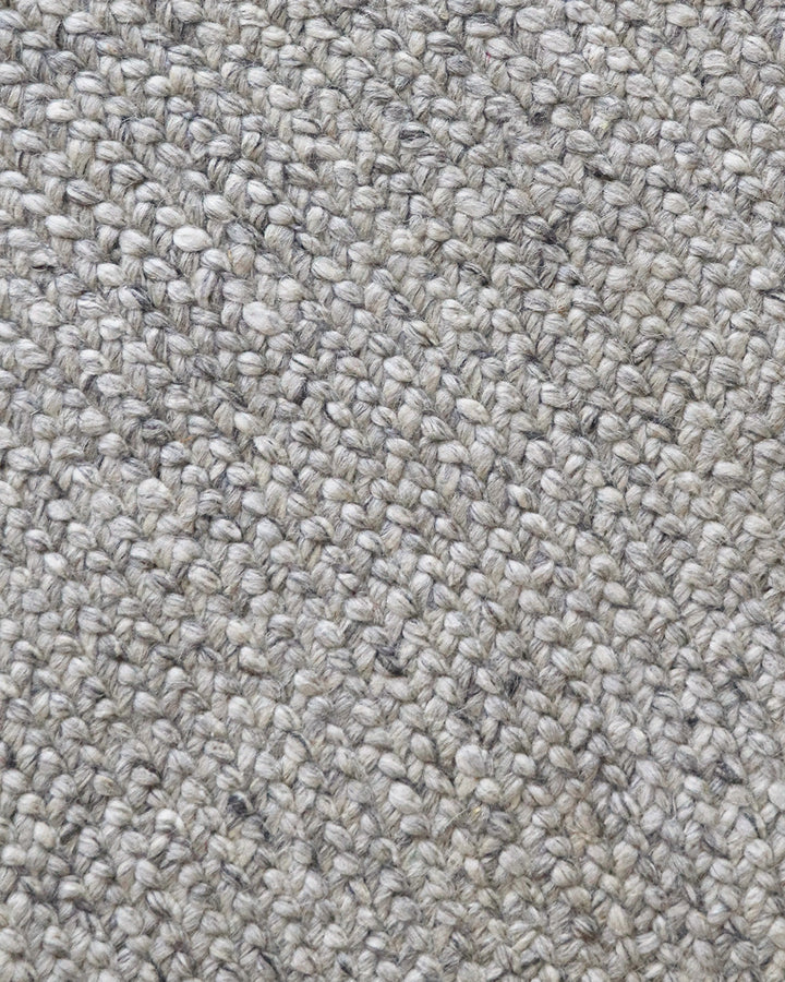 Tairua Floor Rug Anchor key furniture pieces or make the most of smaller spaces with this contemporary braided design. Understated and inviting, the subtly mottled yarn provides a neutral base around which to style a timeless interior. Australian Stock Bu