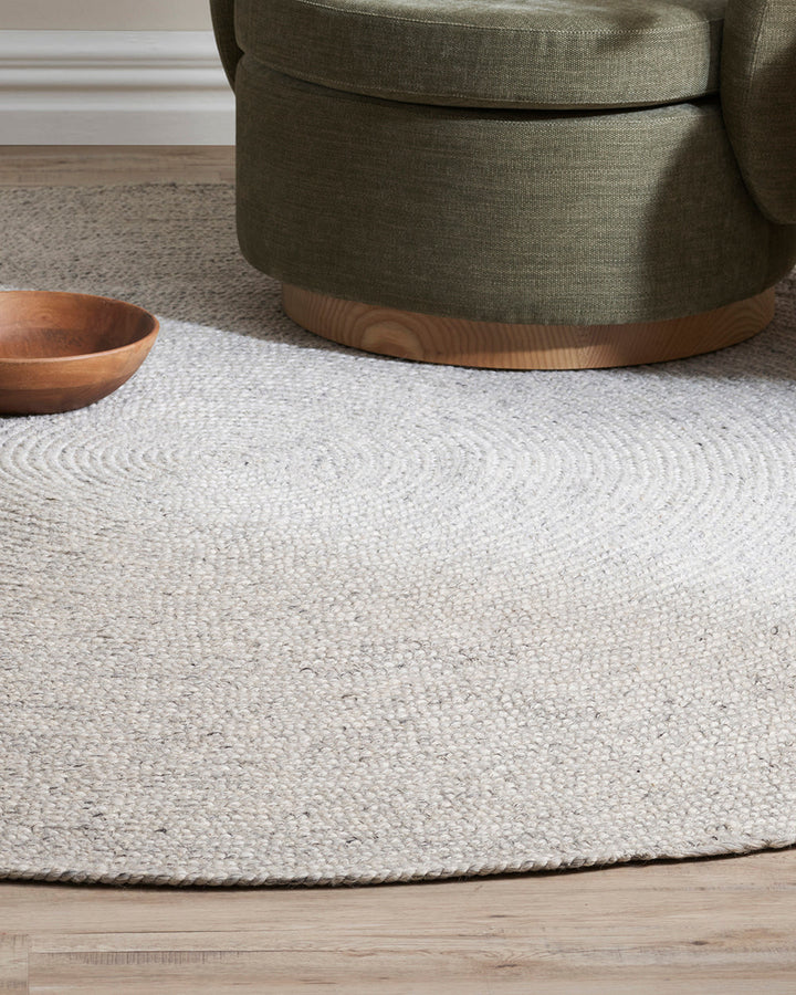 Tairua Floor Rug Anchor key furniture pieces or make the most of smaller spaces with this contemporary braided design. Understated and inviting, the subtly mottled yarn provides a neutral base around which to style a timeless interior. Australian Stock Bu