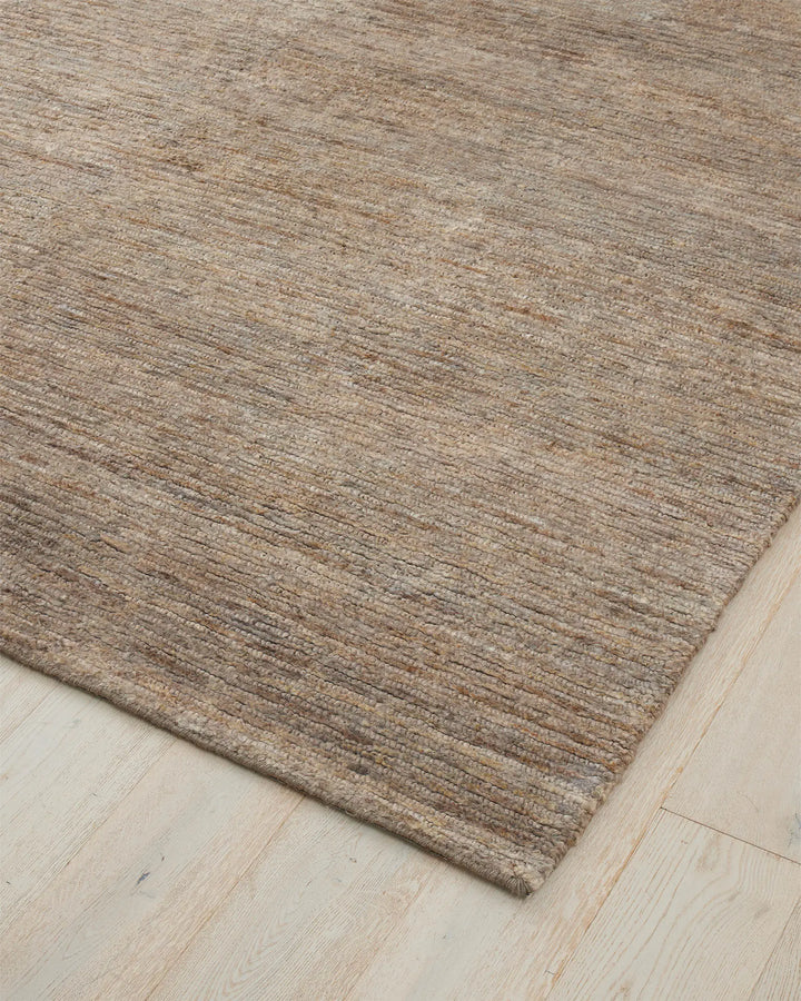 Bastian Fossil - Natural Jute Rug Discover the Bastian Fossil rug, a handcrafted jute masterpiece offering durability and unique texture for your home.