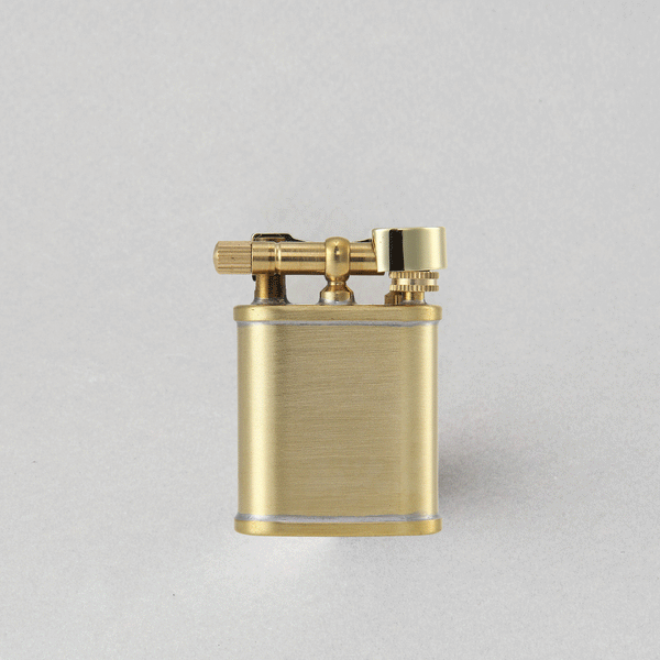 Luxurious Tsubota Pearl Bolbo short brass petrol lighter, handcrafted in Tokyo with a raw brass body.