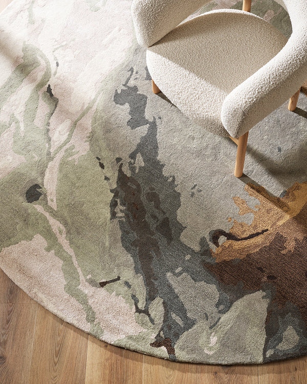Uluru Round Floor Rug Inspired by aerial photography and geological layering, the Uluru is a stunning focal point to style your room around. Handtufted in a soft wool-viscose blend, the muted tones of ivory, sage, grey and ochre are easily paired with com
