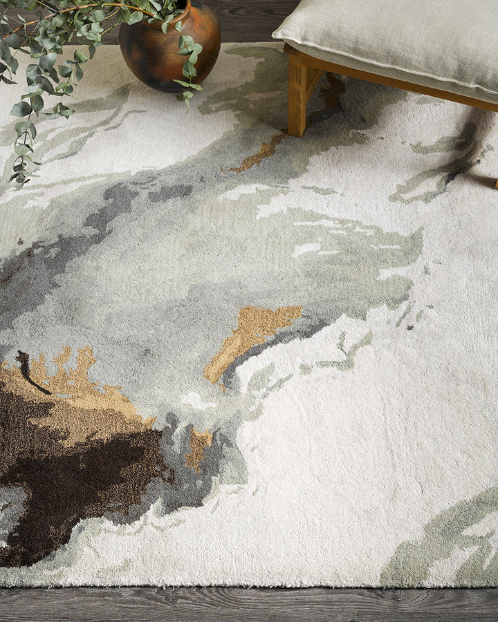 Uluru Floor Rug Inspired by aerial photography and geological layering, the Uluru is a stunning focal point to style your room around. Handtufted in a soft wool-viscose blend, the muted tones of ivory, sage, grey and ochre are easily paired with complemen