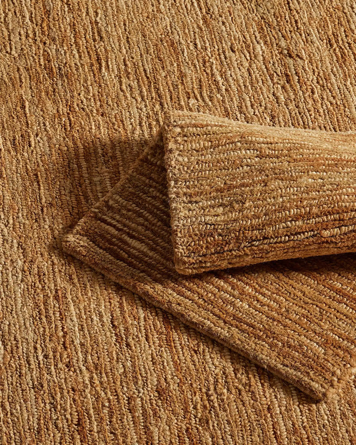 Bastian Natural - Handcrafted Jute Rug Bastian Natural offers a unique, durable jute rug combining artistry and craftsmanship for a rich tactile experience in your space.