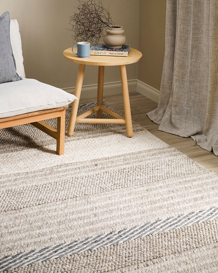 Valley Floor Rug Inspired by dry landscapes and the stony riverbeds of Southland, the Valleyâ€™s design features a range of different weaving techniques in a beautiful wool and cotton blend. Tones of muted blue, ivory and taupe harmonise to create a relax