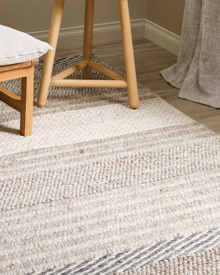 Valley Floor Rug Inspired by dry landscapes and the stony riverbeds of Southland, the Valleyâ€™s design features a range of different weaving techniques in a beautiful wool and cotton blend. Tones of muted blue, ivory and taupe harmonise to create a relax