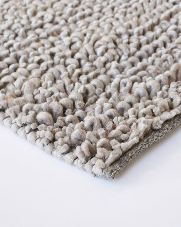 Wanaka Floor Rug Add texture and depth to a room with the beauty of our Wanaka floor rug. A felted blend of New Zealand wool is carefully crafted into a cut and loop pile to create a distinctive surface and luxurious underfoot feel. The rich texture and t