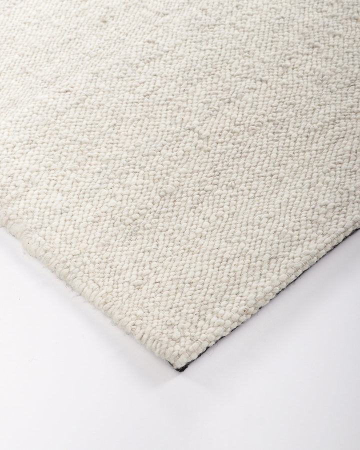 Wichita Floor Rug Add subtle texture to your space with the simplicity of pure wool. Handwoven by skilled artisans, the undyed ecru tone and tight slubby weave construction of the Wichita creates warmth and depth for contemporary living. Australian Stock