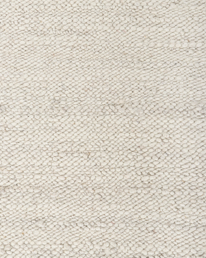 Wichita Floor Rug Add subtle texture to your space with the simplicity of pure wool. Handwoven by skilled artisans, the undyed ecru tone and tight slubby weave construction of the Wichita creates warmth and depth for contemporary living. Australian Stock