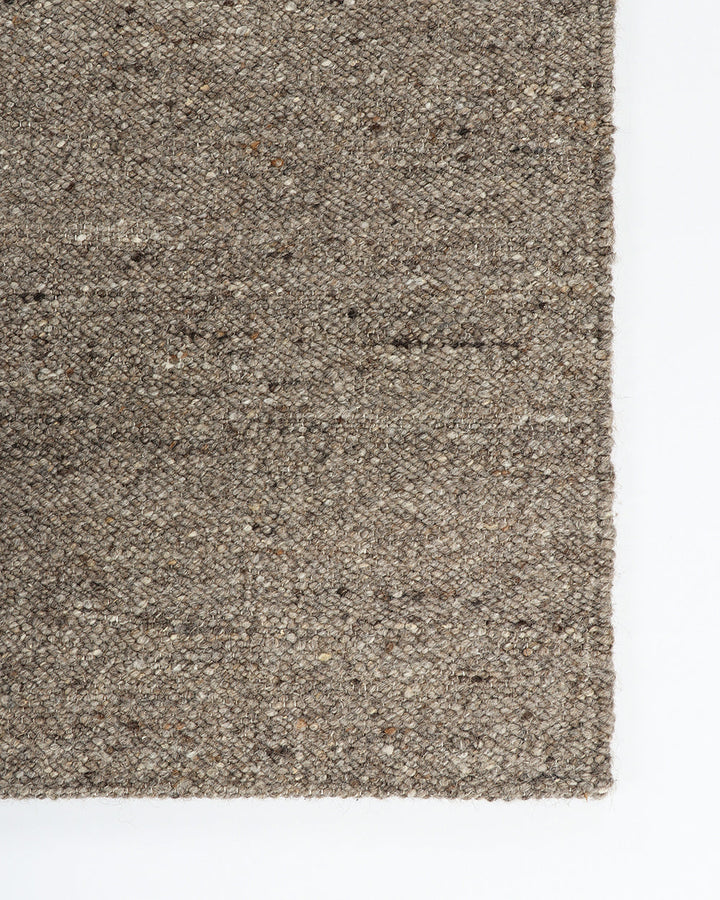 Wichita Floor Rug Add subtle texture to your space with the simplicity of pure wool. Handwoven by skilled artisans, the undyed ecru tone and tight slubby weave construction of the Wichita creates warmth and depth for contemporary living. Australian Stock