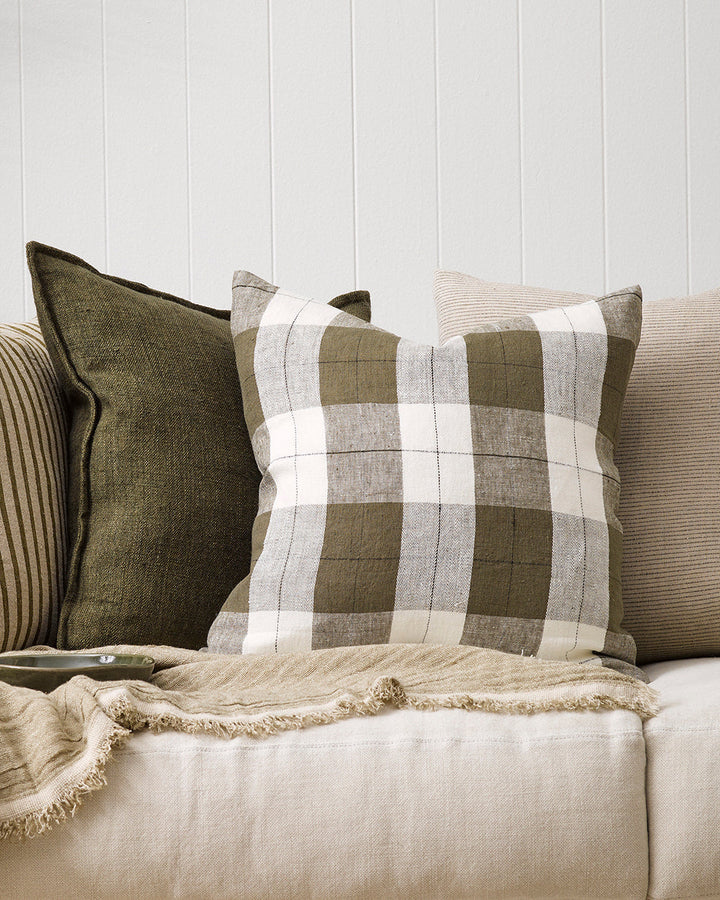 Willis Cushion Country charm is reinterpreted for urban living with Willis â€“ a relaxed, handwoven plaid design. In a modern twist, traditional fabric is re-imagined in a rich tobacco tone that is both elegant and understated. Pair with tones in compleme