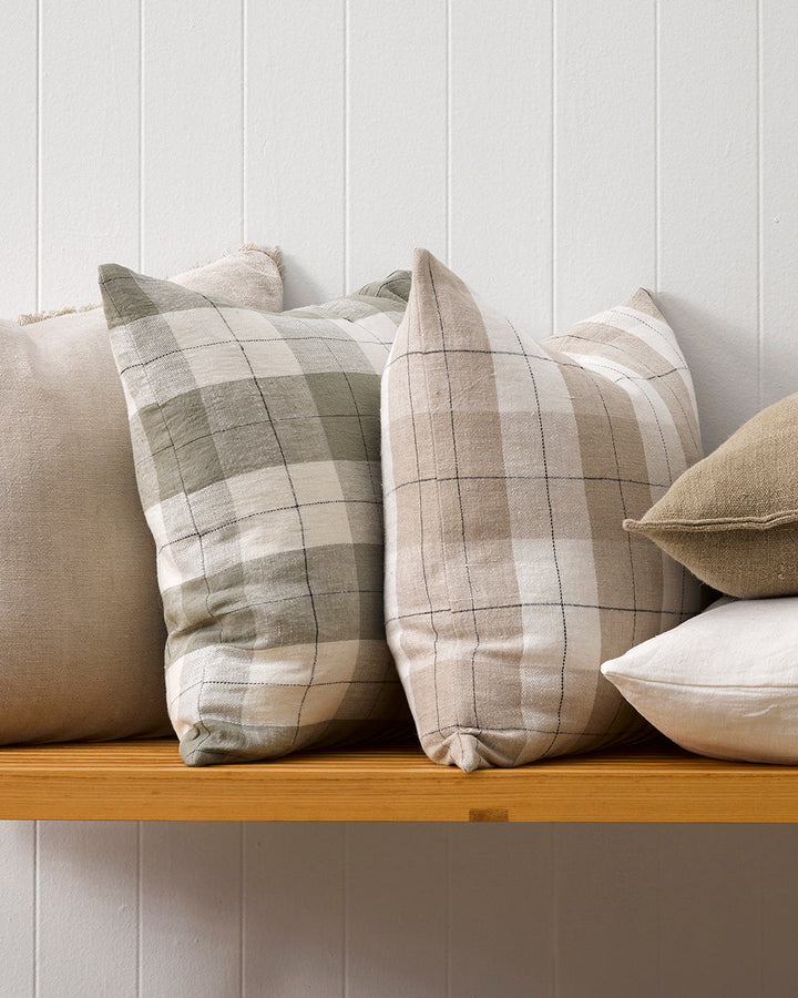 Willis Cushion Country charm is reinterpreted for urban living with Willis â€“ a relaxed, handwoven plaid design. In a modern twist, traditional fabric is re-imagined in a rich tobacco tone that is both elegant and understated. Pair with tones in compleme