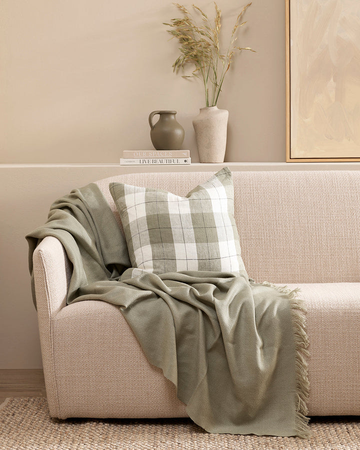 Willis Cushion Country charm is reinterpreted for urban living with Willis â€“ a relaxed, handwoven plaid design. In a modern twist, traditional fabric is re-imagined in a rich tobacco tone that is both elegant and understated. Pair with tones in compleme