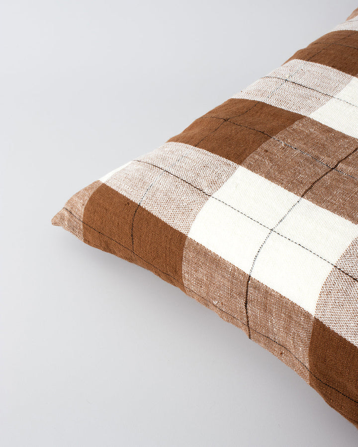 Willis Cushion Country charm is reinterpreted for urban living with Willis â€“ a relaxed, handwoven plaid design. In a modern twist, traditional fabric is re-imagined in a rich tobacco tone that is both elegant and understated. Pair with tones in compleme