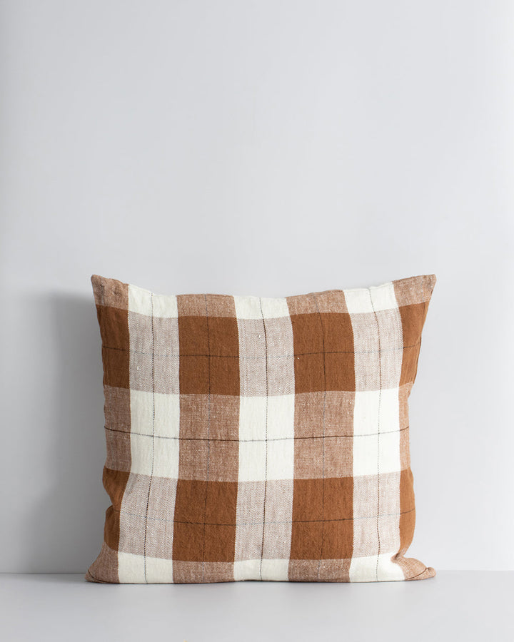 Willis Cushion Country charm is reinterpreted for urban living with Willis â€“ a relaxed, handwoven plaid design. In a modern twist, traditional fabric is re-imagined in a rich tobacco tone that is both elegant and understated. Pair with tones in compleme