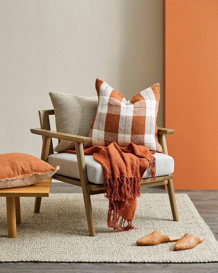 Willis Cushion Country charm is reinterpreted for urban living with Willis â€“ a relaxed, handwoven plaid design. In a modern twist, traditional fabric is re-imagined in a rich tobacco tone that is both elegant and understated. Pair with tones in compleme