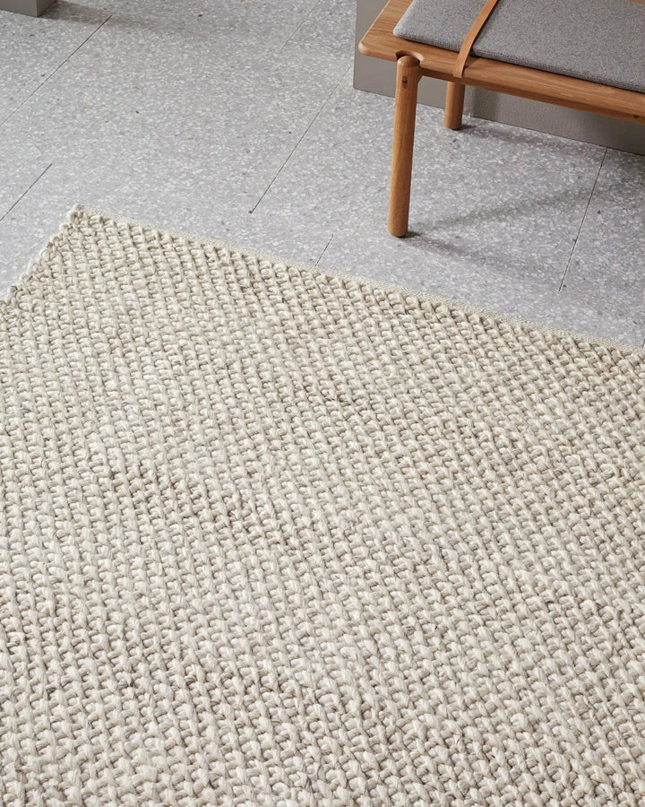 Emerson Seasalt - Luxurious Thick Rug Emerson Seasalt offers a soft, textured rug in a warm off-white tone, perfect for bedrooms and more with a durable cotton backing.