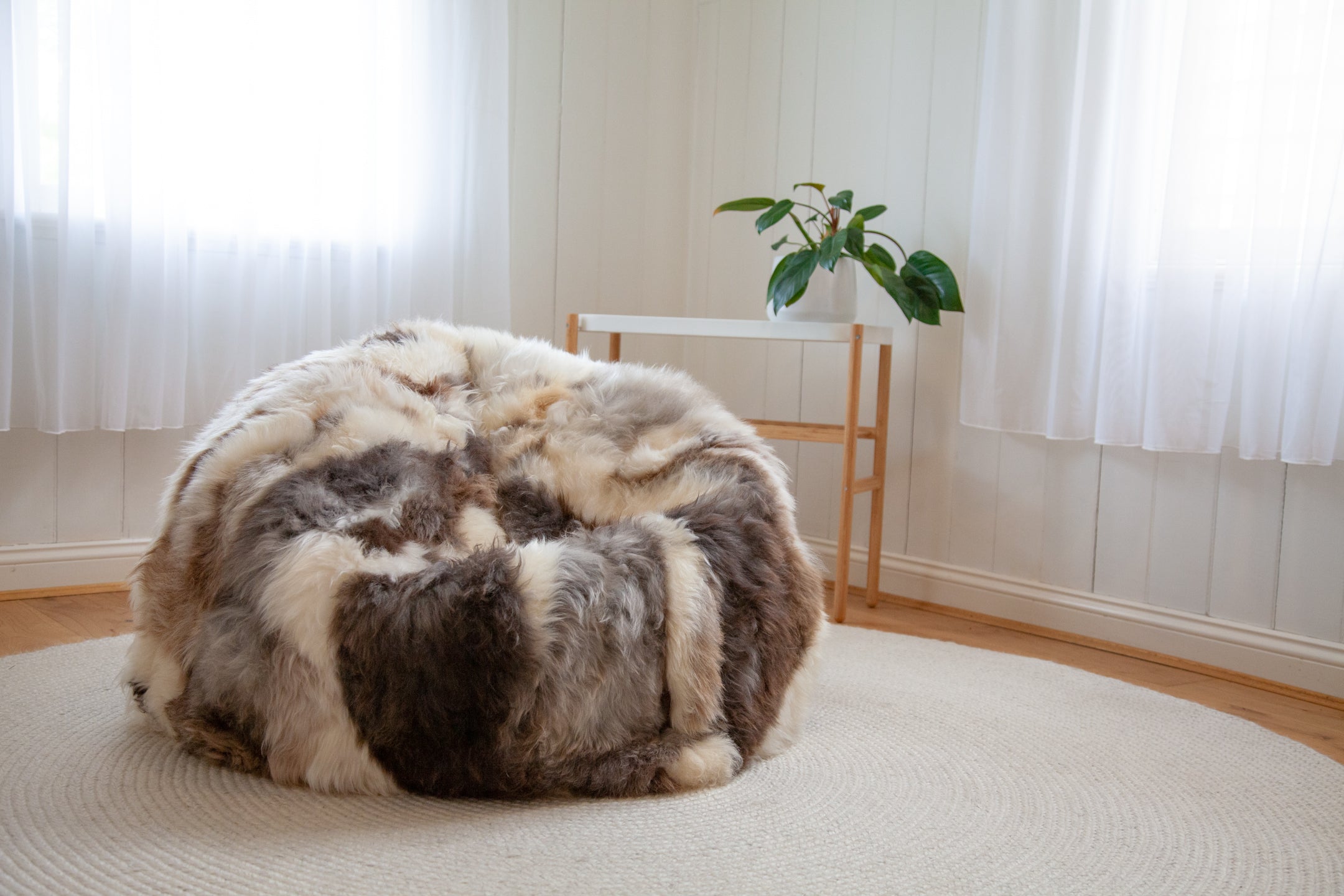 Himalayan Lhasa Longwool Sheepskin Bean Bag with safety zipper, 100% polystyrene bean fill, leather base. Enjoy a high-quality furniture piece that is soft and comfortable with its unique natural long