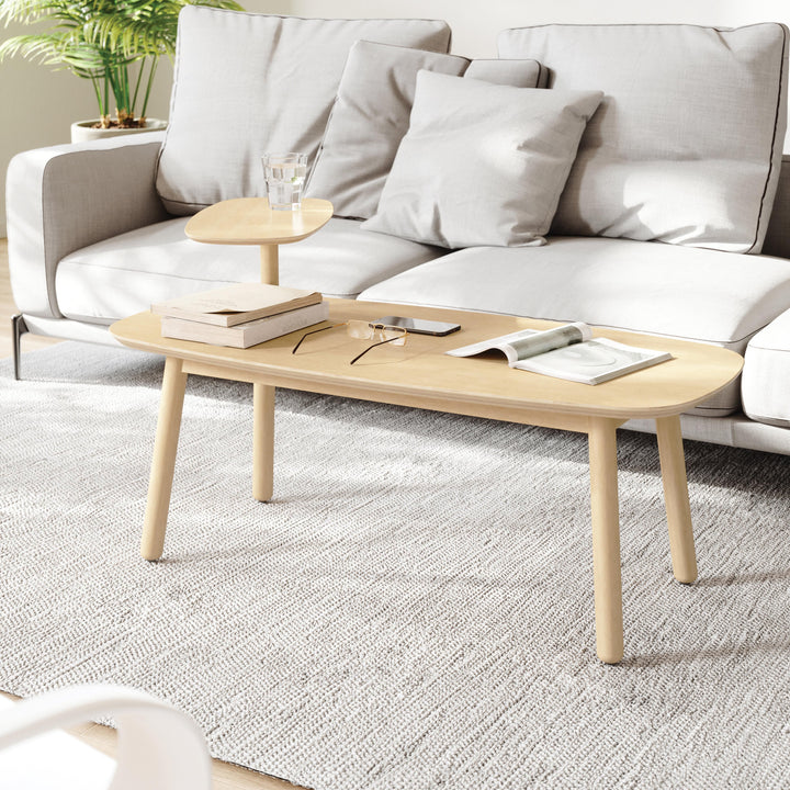 Umbra Swivo Coffee Table In Natural A simple and elegant coffee table, Swivo features a swiveling top tier, providing space for a small plant, tv remotes, drinks and more. With a real wood finish and soft curves, this coffee table adds a subtle modern tou