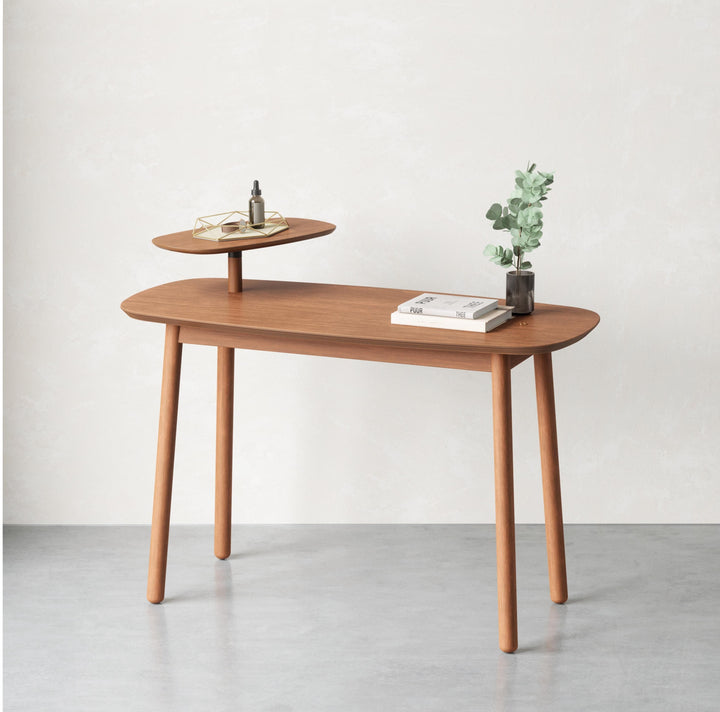 Umbra Swivo Desk Light Walnut 27X56X90Cm Featuring real wood and gentle curves, the Swivo Desk is part of Umbra's Swivo Collection which includes a coffee and side table. Thoughtfully designed with a swivelling top tier, this minimalist, natural-finish de