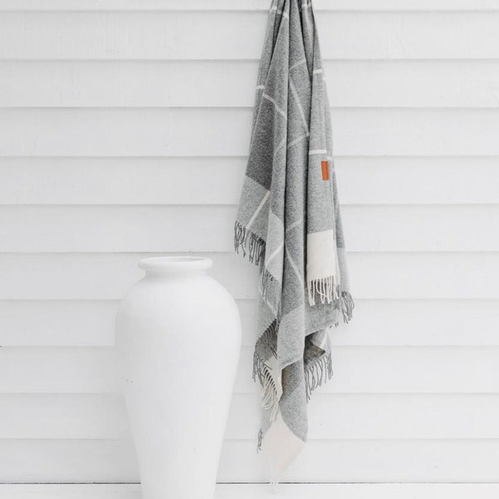 Buy Ascot Merino Wool Throw - Grey | Throws |The Ascot 100% Merino Wool Throw in Grey has been hand loomed in Lithuania from the finest Merino Wool sourced from the rolling hills of Australia &amp; New Zealand. Naturally soft and over sized, The Ascot Merino Wool Throw has a classic large plaid design with a modern minimalist twist. Ava... by Huxford Grove at BEON.COM.AU