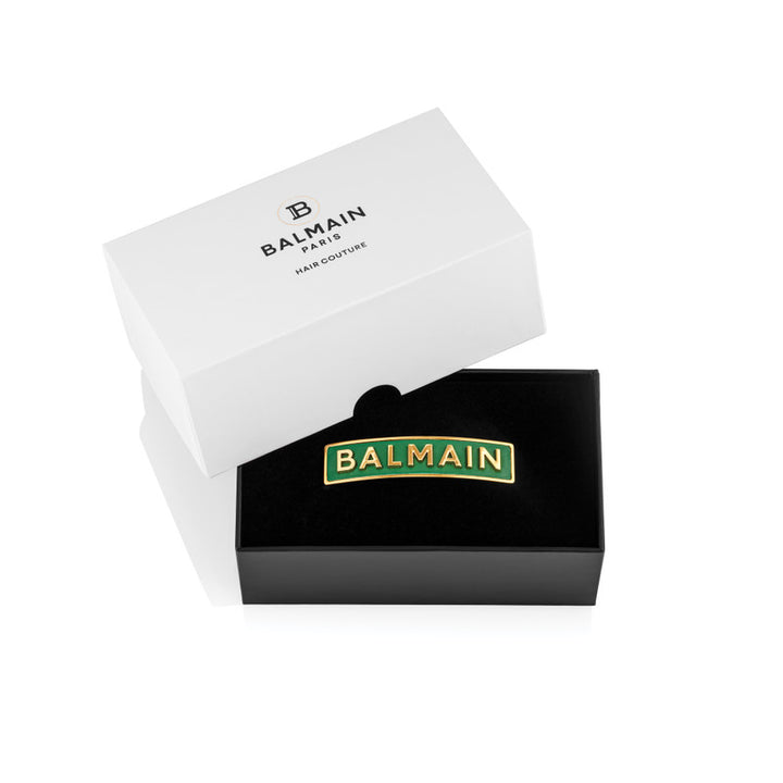 Balmain Limited Edition Green & Golden Logo Barrette Fw22 Handcrafted limited edition emerald green hair accessory with 18K gold plated logo. Made from genuine napa leather and topped with the signature logo lettering. The hair accessory secures with a Fr