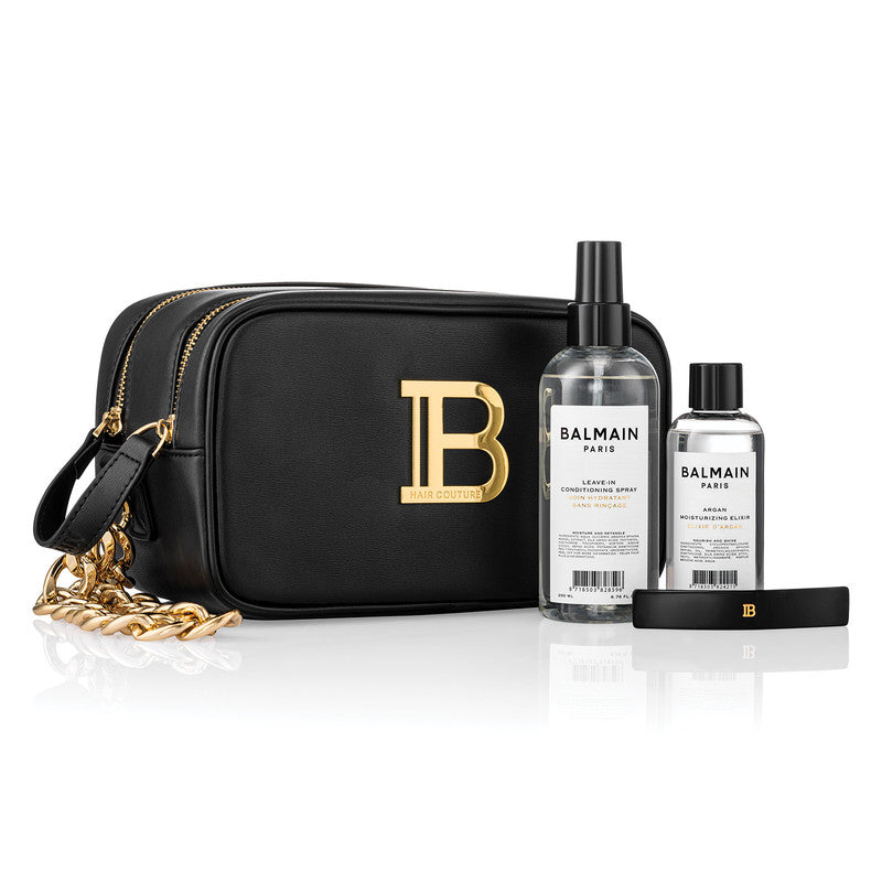 Balmain Black Pouch Fw22 Signature vegan leather pouch embellished with golden logo plaque. Perfect to store all hair care essentials. Including the bestselling Signature Foundation duo to create the perfect styling base for any hairstyle and a Barrette p