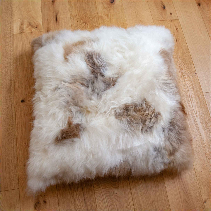 Buy Lhasa Floor Cushion | Lhasa Floor Cushion by Fibre at BEON | Himalyan Longwool Sheepskin Cushion with zipper, 100% polyester cushion inner, microsuede base. Size The perfect combination of luxurious comfort and style, this cushion helps bring a sophis