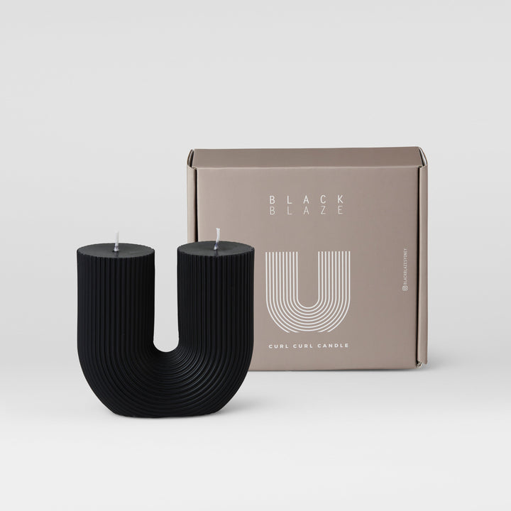 Curl Curl Candle - Black Pillar Candle Available at BEON | Curl Curl is the name of a beach in Sydney. The word Curl Curl may have been derived from a Dharuk Aboriginal phrase curial curial, meaning river of life. The shape of the Curl Curl candle is insp