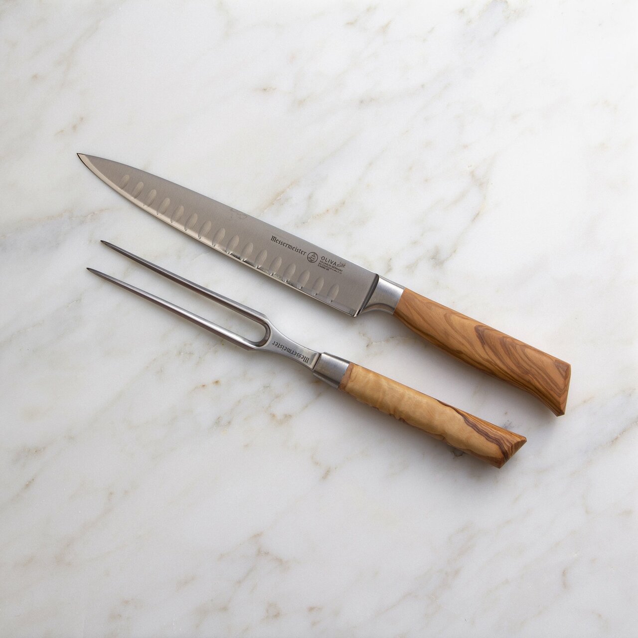 BEON.COM.AU Oliva Elité 2 Piece Kullenschliff Carving Set The Messermeister Oliva Elité Carving Set consists of an 8 Inch Kullenschliff Carving Knife (E6688 8K) and a 6 Inch Straight Carving Fork (E6805 6).This is the perfect addition to your cutlery collection. Impress your guests by carving large roasts an... Messermeister at BEON.COM.AU