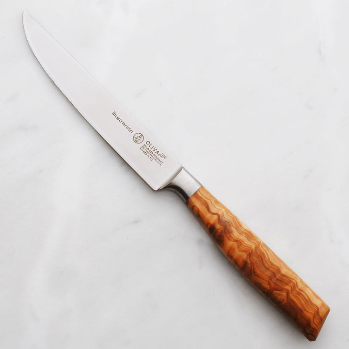 Buy online & save Oliva Elite Multi-Edge Steak Knife 4.5 Inch (11.4cm) |Messermeister |BEON.COM.AU E6683 4         Oliva Elite 4.5 Inch Multi-Edge Steak Knife The Messermeister Oliva Elite Steak Knife is a 3.5 Inch personal sized carving knife. This steak knife is expertly crafted and has a slicing blade with an upward curved tip. The main cutting edge on this steak knife is used to slice indi... Messermeister at BEON.COM.AU