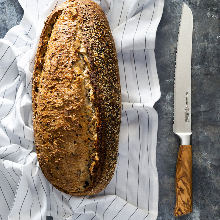 Buy online & save Oliva Elite Scalloped Bread Knife 9 Inch (22.9cm) |Messermeister |BEON.COM.AU E6699 9         Oliva Elite 9 Inch Scalloped Bread Knife The Messermeister Oliva Elite 9 Inch Bread Knife has a scalloped edge with a gentle camber. Serrations on this knife’s scalloped edge produce smooth, clean and precise cuts whether you’re slicing bread or soft-skinned fruits and vegetables.... Messermeister at BEON.COM.AU