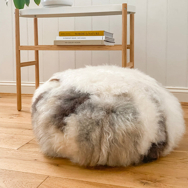 Buy Lhasa Ottoman | Lhasa Ottoman by Fibre at BEON | Himalayan Lhasa Longwool Sheepskin Ottoman with safety zipper, 100% polystyrene bean fill, leather base.