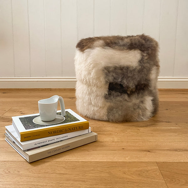 Buy Lhasa Ottoman | Lhasa Ottoman by Fibre at BEON | Himalayan Lhasa Longwool Sheepskin Ottoman with safety zipper, 100% polystyrene bean fill, leather base.