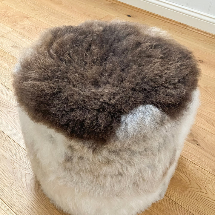 Buy Lhasa Ottoman | Lhasa Ottoman by Fibre at BEON | Himalayan Lhasa Longwool Sheepskin Ottoman with safety zipper, 100% polystyrene bean fill, leather base.