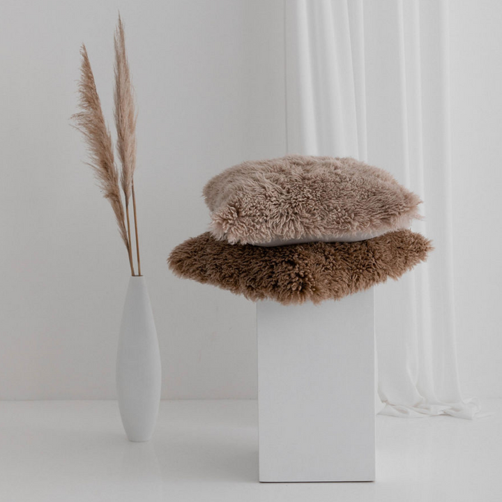 Buy and Save on The Hahndorf Sheepskin Cushions Cushions | Add a touch of luxury and pure comfort to your home with the delicate feel of long wool curly sheepskin. With two warm and neutral colours these cushions are a staple for all year around providing