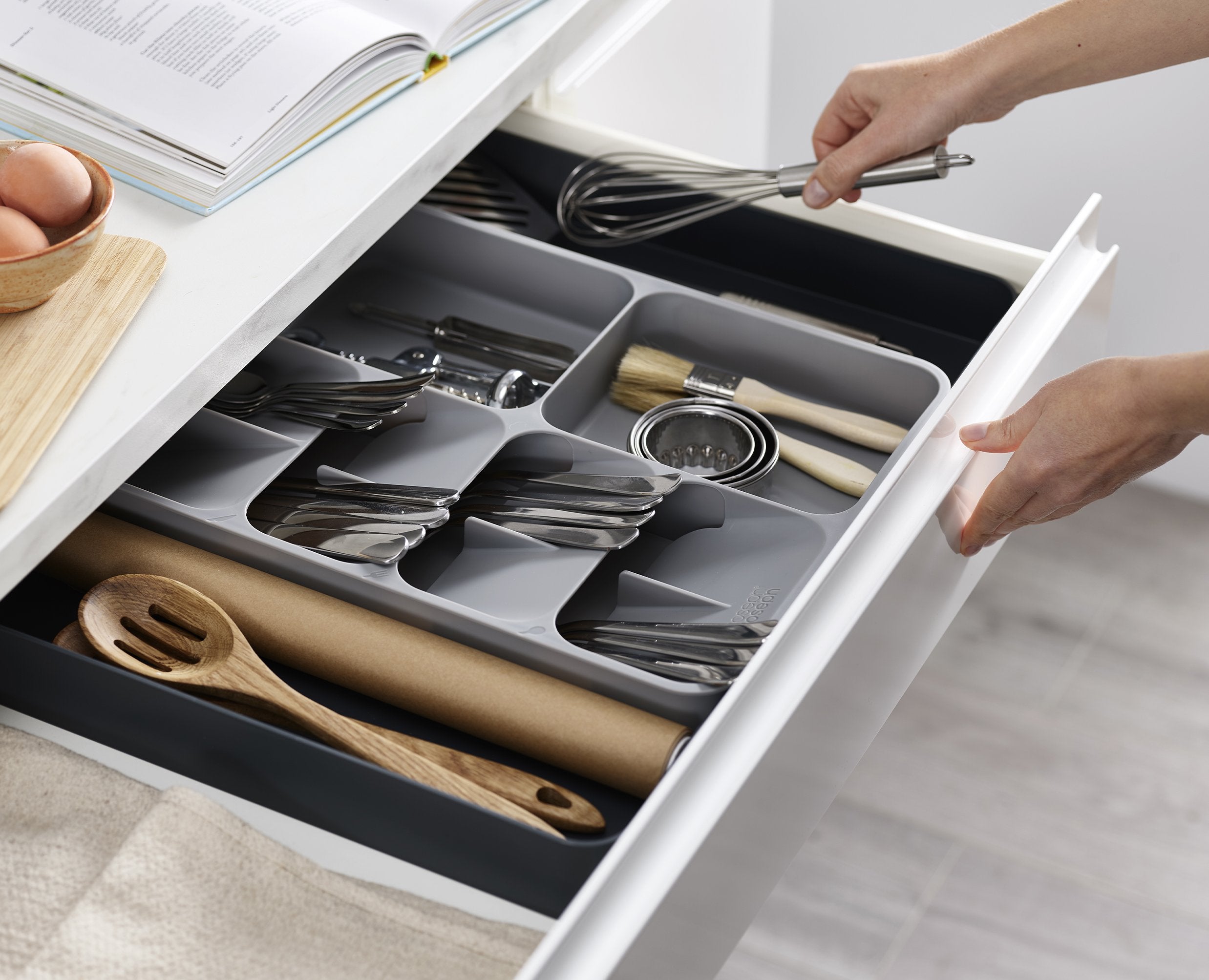BEON.COM.AU  The unique design of this highly practical storage solution features five overlapping compartments for storing cutlery and two deep-sided compartments for holding gadgets so you can easily organise messy cutlery and utensil drawers.  Unique design creates more space in your drawer Stacked compar... Joseph Joseph at BEON.COM.AU