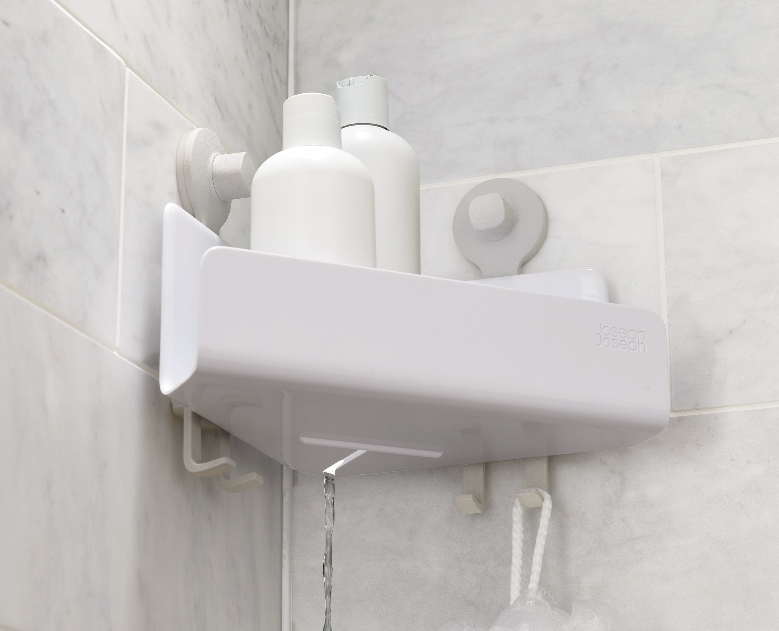 BEON.COM.AU  These corner shower shelves sit neatly in the corner of your shower to store your soap bars, shower gels and shampoo bottles and feature hooks for razors, sponges and flannels.  Self-draining design Handy storage hooks Lift-off shelf for easy cleaning  Easy tool-free installation using super-gri... Joseph Joseph at BEON.COM.AU