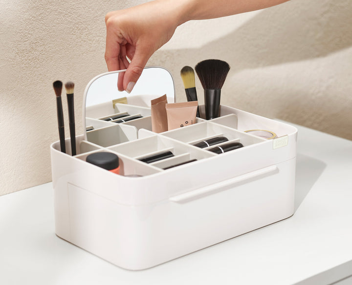 Buy online & save Viva Large Cosmetic Organiser with Removable Mirror | BEON.COM.AU Product Details This all-in-one cosmetic organiser features a mix of deep and shallow compartments plus a large drawer and a removable 2-in-1 mirror that can be stored in a slot at the back or conveniently mounted onto the edge for hands-free use.  Deep compartments for brushes, mascaras and eye-... Joseph Joseph at BEON.COM.AU