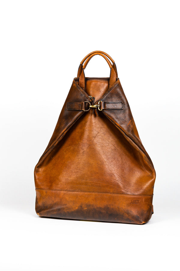 Buy online & save Randers X-Change Bag L | Cognac |Jost |BEON.COM.AU The Jost Randers X-Change Large is a leather bag made in Europe from premium European leathers and fabrics. Cowhide 3 in1 bag that can be worn as a backpack, shoulder bag and handbag Main compartment fits A4, closes with zipper and carabiner Padded laptop compartment, zipped compartment, mobile p... Jost at BEON.COM.AU