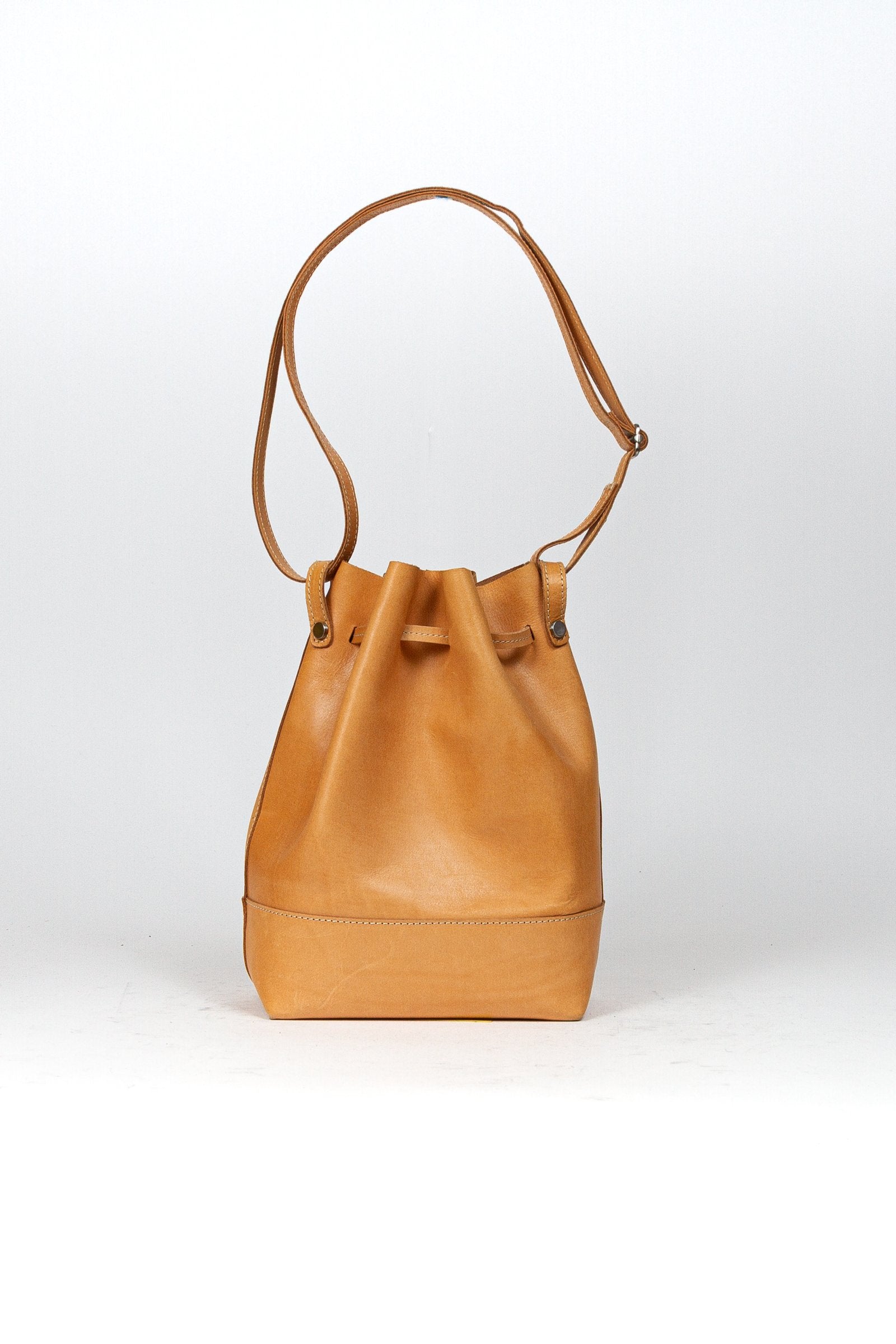 BEON.COM.AU The Jost Vantaa Bucket Bag is a leather bag made in Europe from premium European leathers and fabrics. Vegetable tanned leather (so will age and patina naturally!) Key holder and a removable zipper case Main compartment closes with drawstring Adjustable shoulder strap 66-119 cm  33cm x 22cm x 12c... Jost at BEON.COM.AU