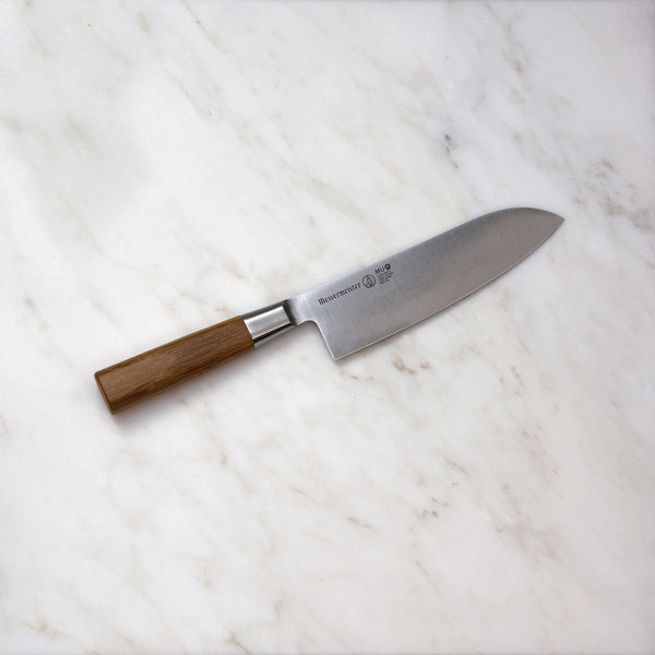 Buy online & save Mu Bamboo Santoku Knife 6.5 Inch (16.5cm) |Messermeister |BEON.COM.AU MU 03      Mu Bamboo Santoku Knife The Messermeister Mu Bamboo 6.5" Santoku Knife, also known as a Japanese Chefs Knife, is a wide blade knife with an overall thinner spine and taper than a French or German style Chefs Knife. The thin taper (or blade thickness) is lengthened to give it maxim... Messermeister at BEON.COM.AU