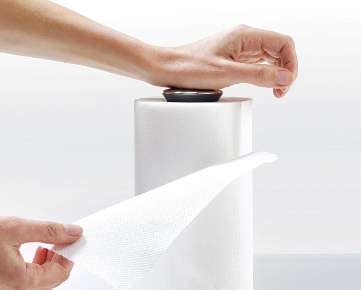 Buy online & save Push&Tear™ Kitchen Roll Holder | BEON.COM.AU  This smart kitchen roll holder features a sprung top cap that can be pushed down to lock the roll for easy tearing.  Push top to lock roll for easy tearing Can be operated with the wrist or forearm when your hands are messy Raised base edge stops roll from unravelling Twist-off cap for quick rol... Joseph Joseph at BEON.COM.AU